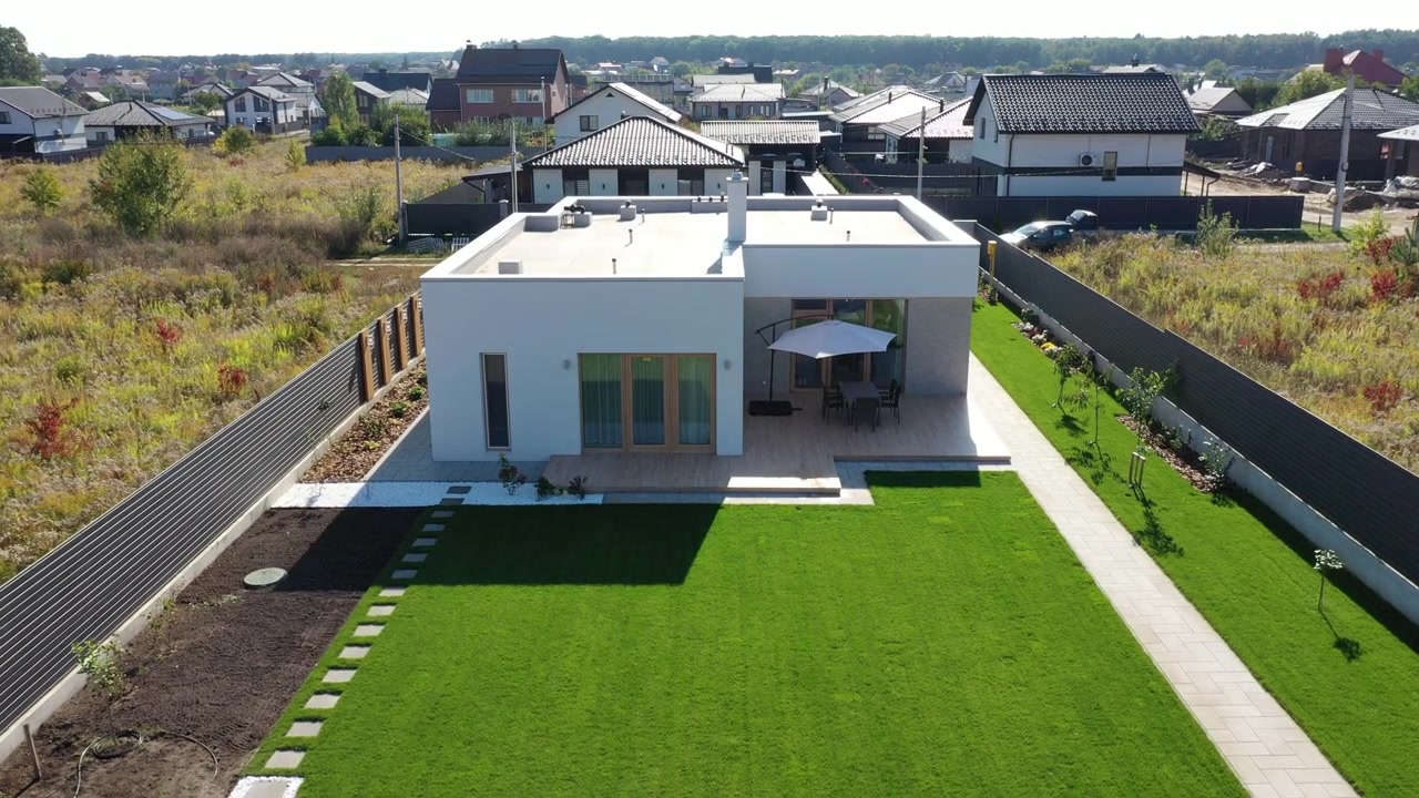 Aerial View of Modern Single-Story House with Green Lawn