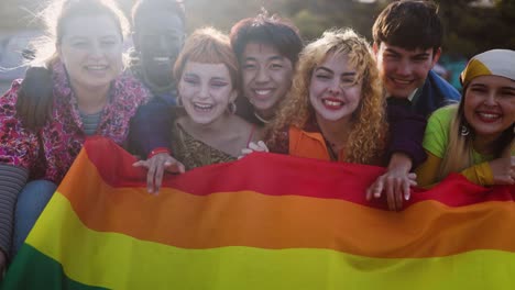 diverse young friends celebrating gay pride festival - lgbtq community concept