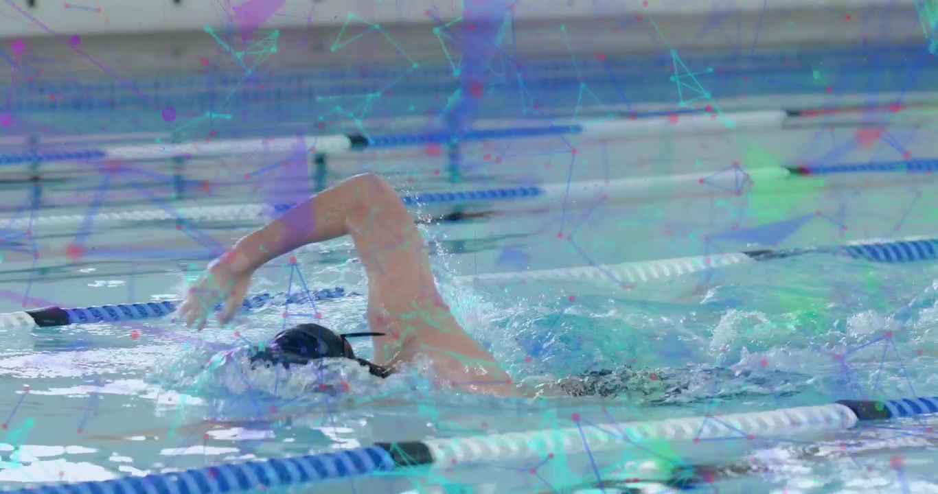 スポーツトレーニングのため、プールでクロールを始める男性スイマーが手を押し下げて加速している。