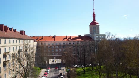 cars parked on the road side by porubsky arc in czech republic