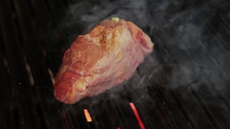 juicy steak being grilled on a charcoal grill, capturing a classic cooking technique