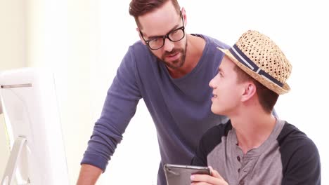 Homosexual-couple-using-tablet-