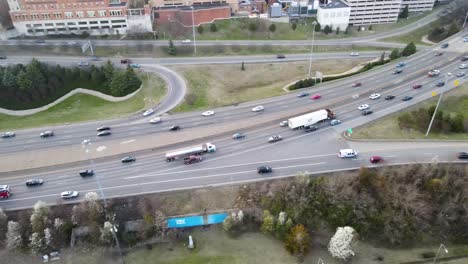 Rush-Hour-Traffic-on-Interstate-95-by-Downtown-Richmond,-Virginia-|-Aerial-View-Panning-Across-|-Winter-2022