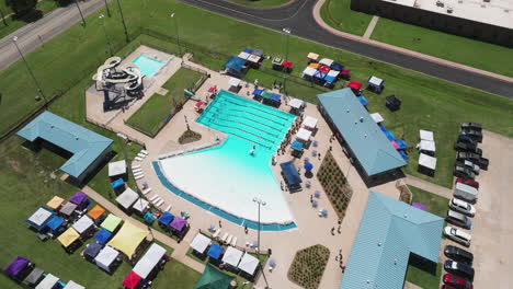 aerial view of swimming pool at swim club in siloam springs during summer swim meet in arkansas, usa