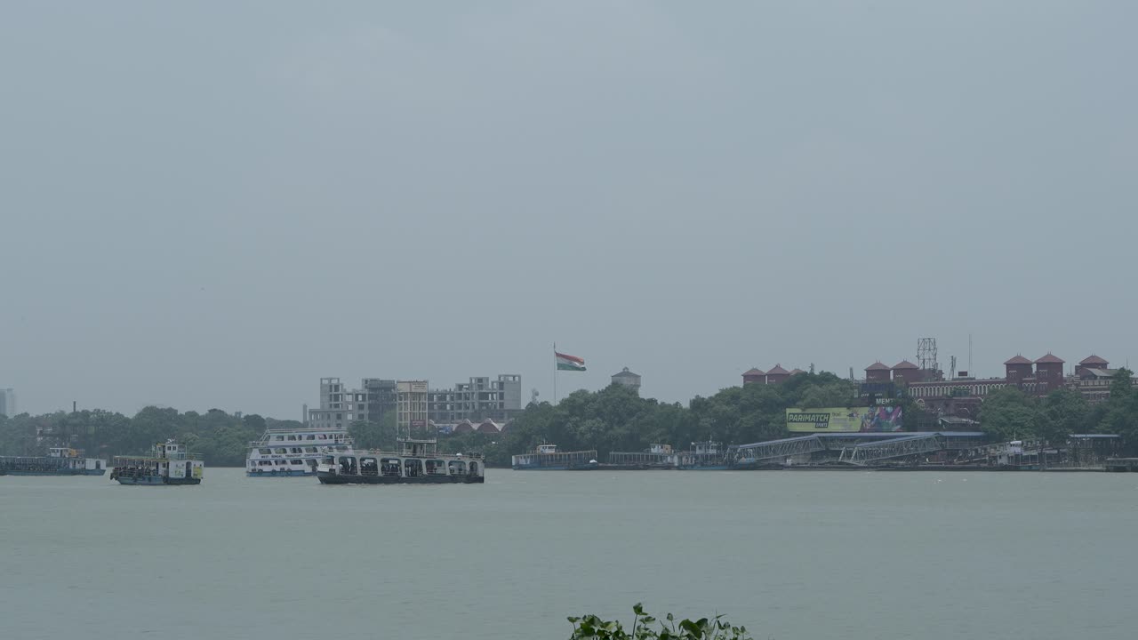 Boats and Buildings on a Hazy River in India