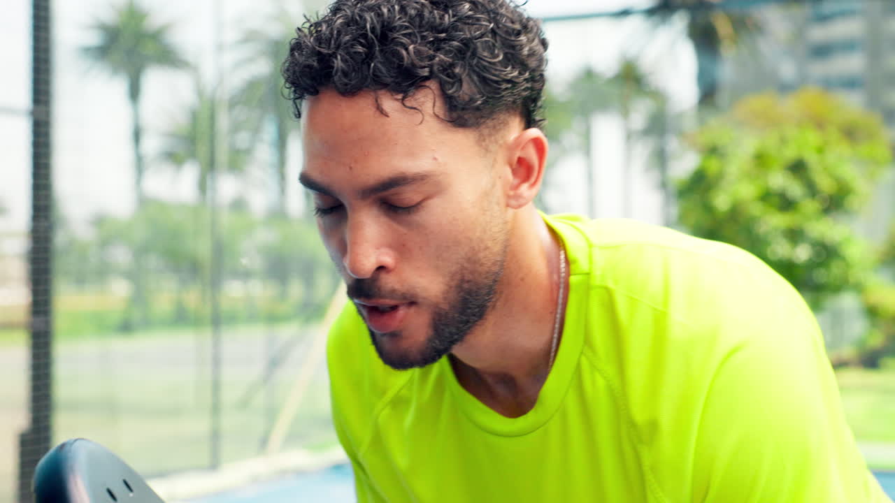 Focused Male Athlete Breathing Heavily During an Outdoor Sports Game