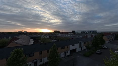 Sunset-clouds-time-lapse-passing-over-Enfield-lock-housing-apartments-in-London-city-suburbs