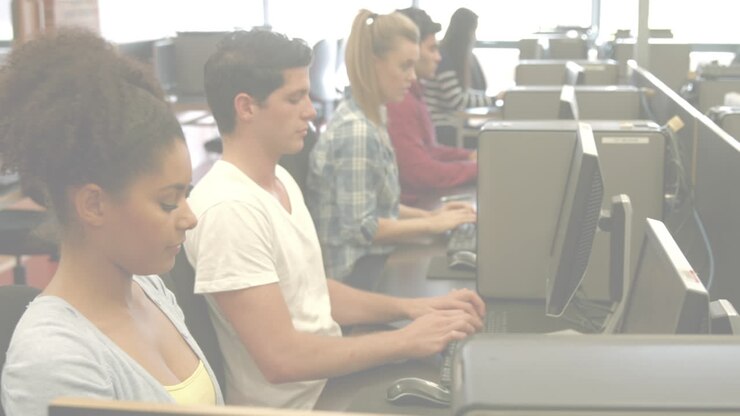 Animation of light background over diverse students using computers