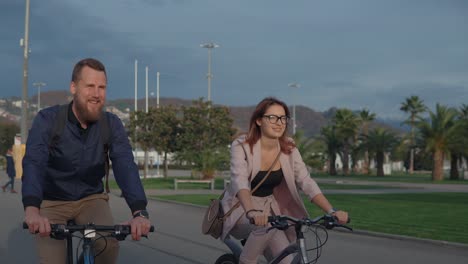 couple cycling in a park