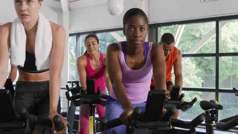 Working-out-on-exercise-bikes-at-a-gym