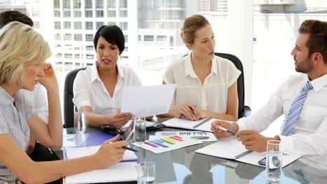 business people going over figures at meeting