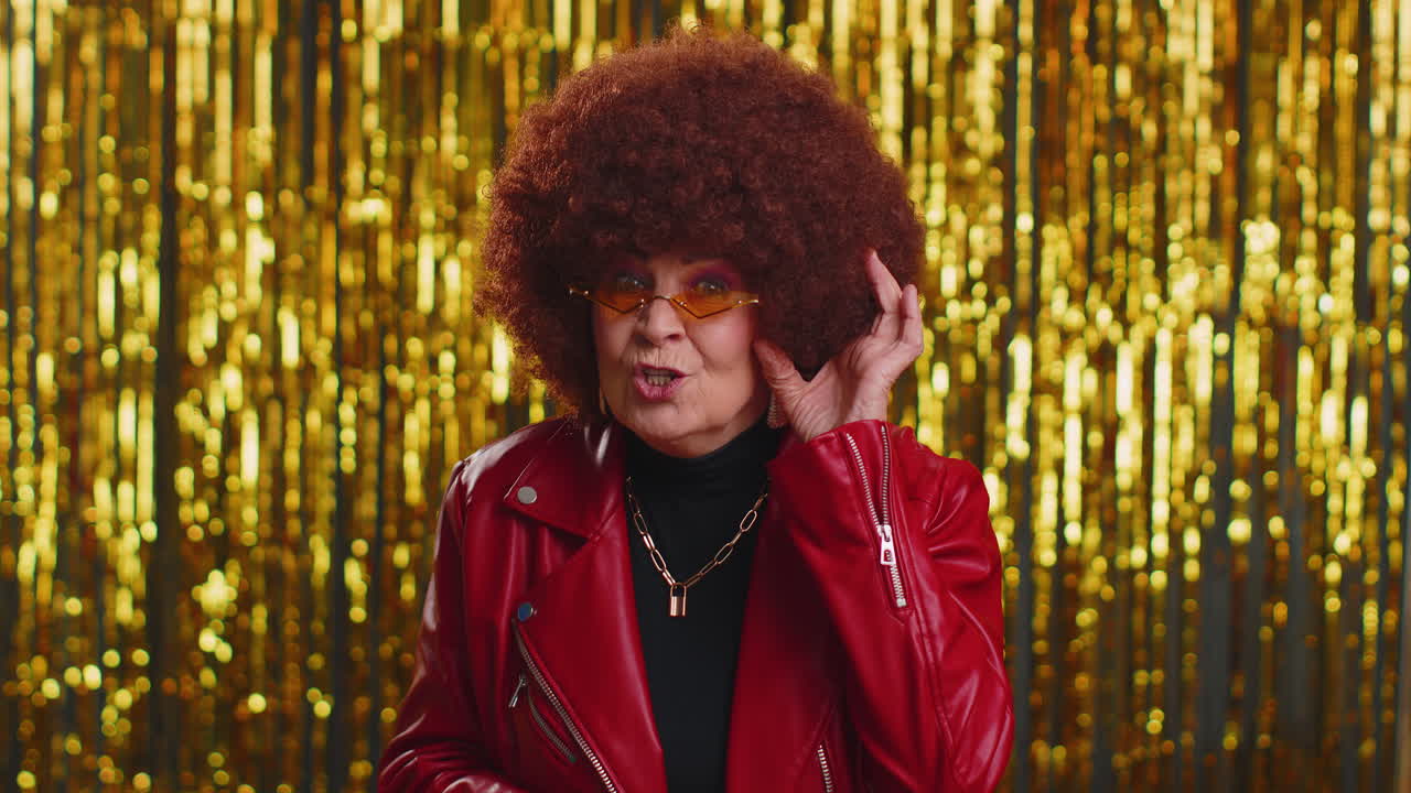 Woman trying hear you, looking confused and frowning, keeping arm near ear for louder voice, repeat