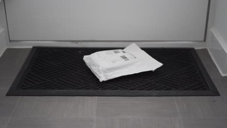 parcel laying on doormat after delivery