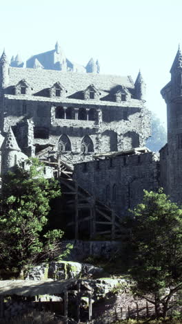 a stone castle ruin with a tower and a gate