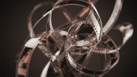 an abstract composition of twisted film strips displaying the dynamic movement and artistic beauty of vintage cinematic elements in a dark background