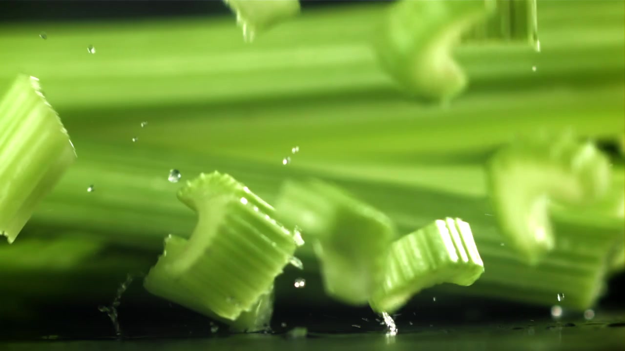 Fresh Chopped Celery Pieces Falling in Slow Motion