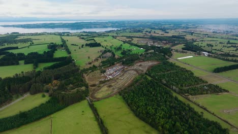 Aerial-Overhead-Establishing-View-Motor-Race-On-Muddy-Racetrack-At-Frutillar,-Los-Lagos-Region,-Chile