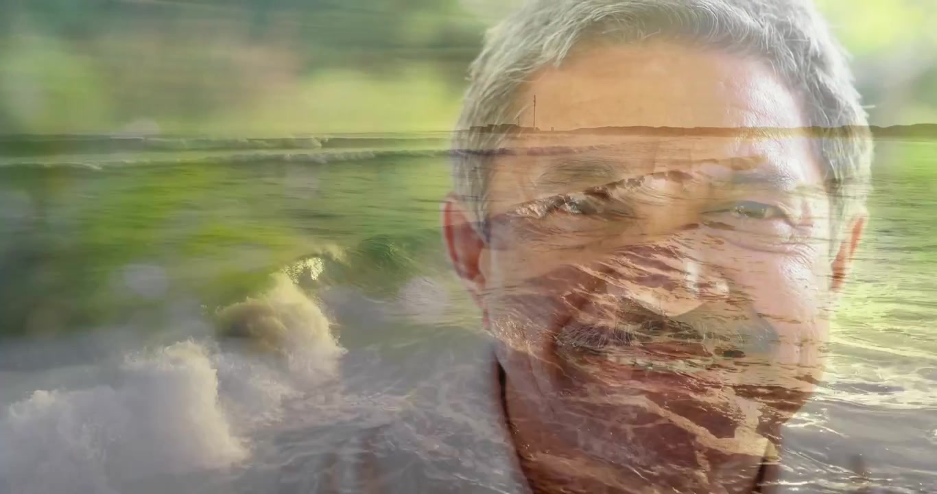 Frames starting crossfade, senior man holding pose while ocean blending face, evoking wellness calm