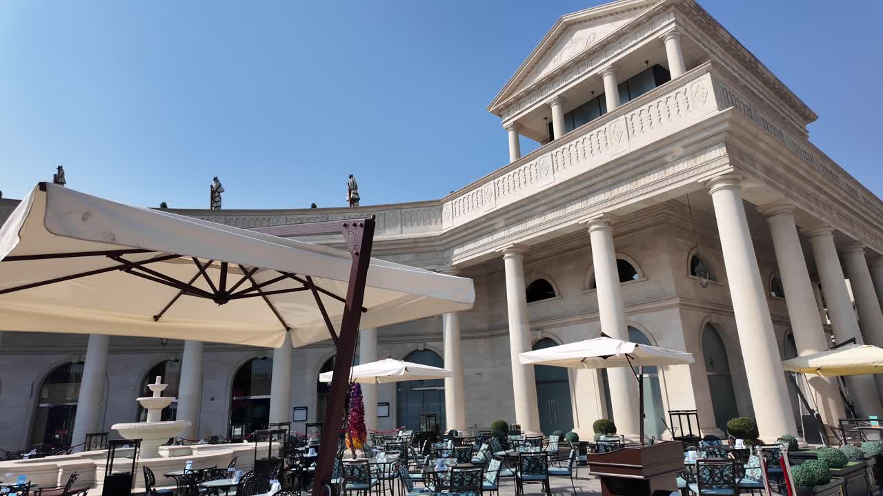 Elegant outdoor dining area in a classical architectural setting