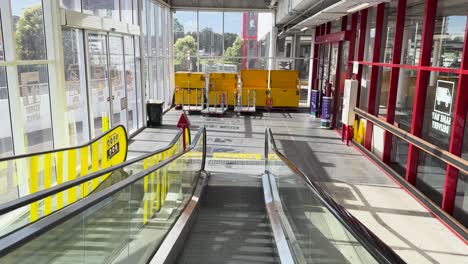 escalator blocked for maintenance in department store