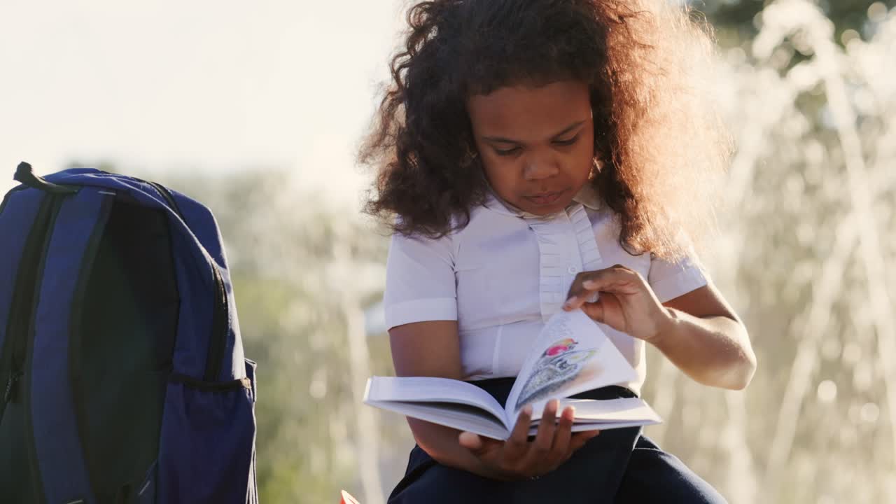 Young Girl Reading Outdoors