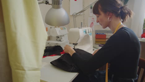 Seamstress-Using-Sewing-Machine-at-Work