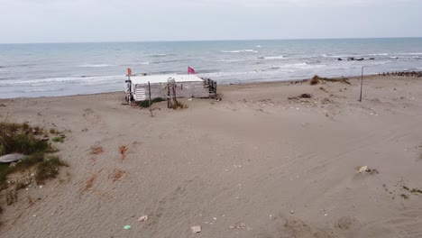 motorhome at sandy beach in albania - aerial drone view