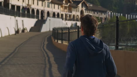 man running through a european town