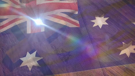 animation of clouds moving over waving flag of australia, wood, sunlight and blue sky