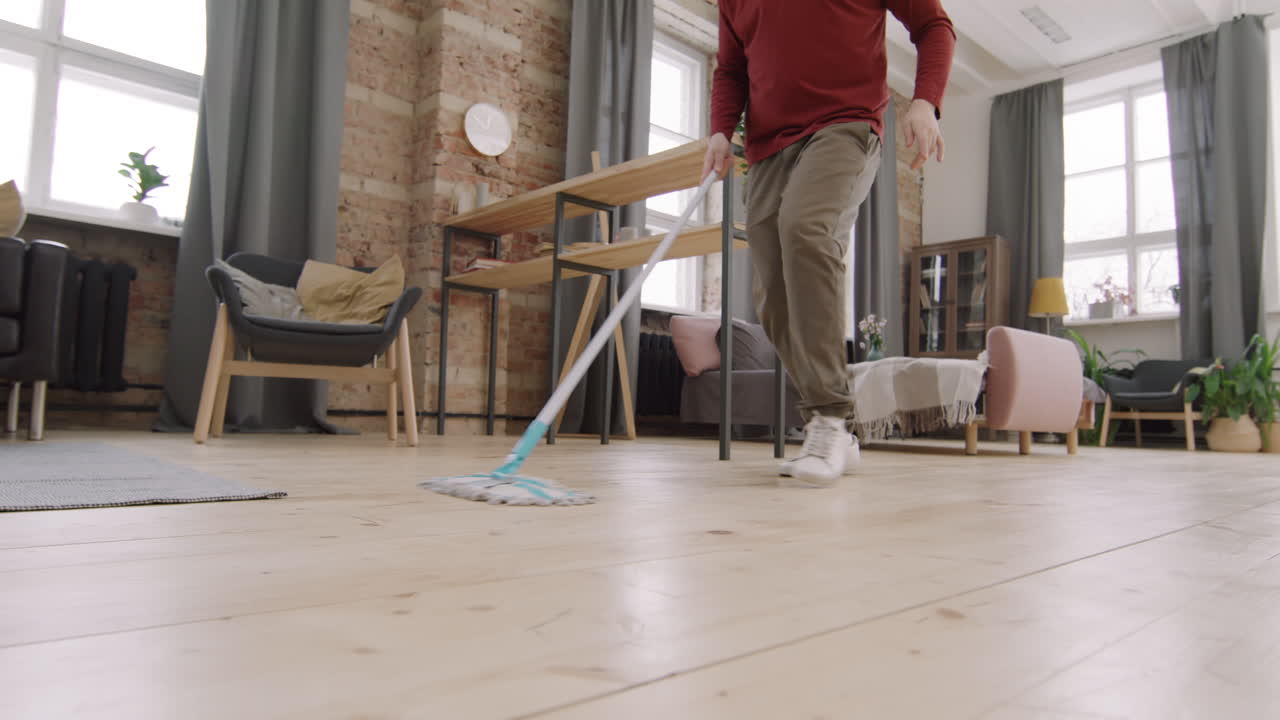 Unrecognizable Guy Mopping Floor and Dancing