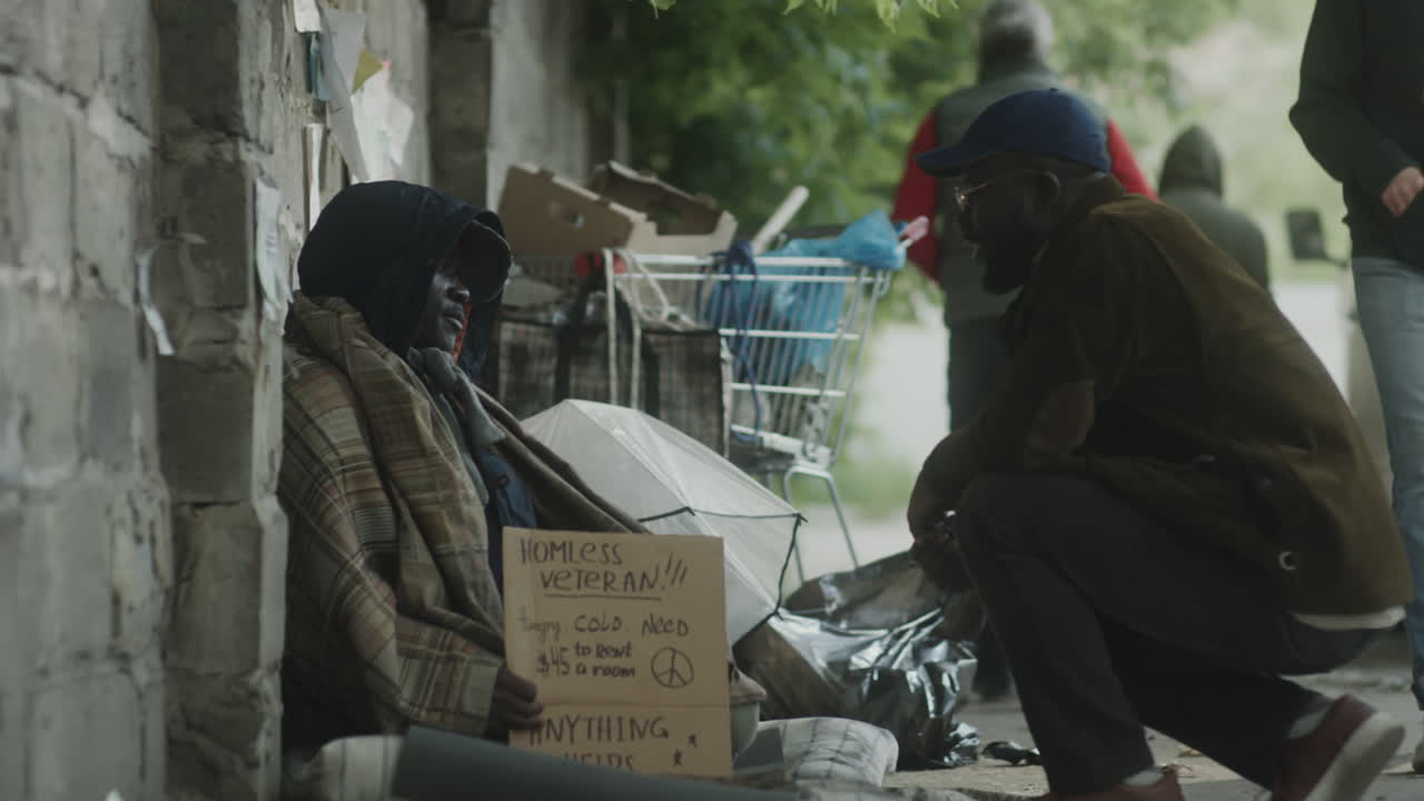 Passer By Supporting Street Beggar