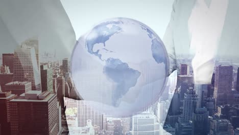 animation of globe over mid section of businessman and businesswoman shaking hands against cityscape