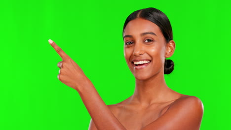 Skincare,-smile-and-a-woman-pointing-on-a-green
