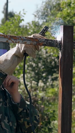 welding a metal fence post