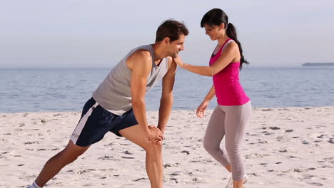 Man-and-woman-stretching-together