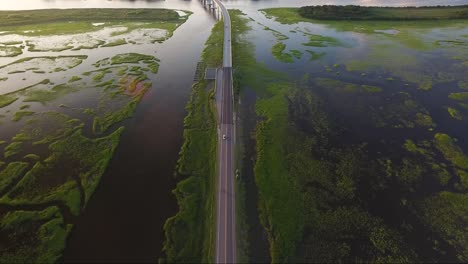 Flying-backwards-over-causeway-in-Ocean-Isle-Beach-NC-at-sunset