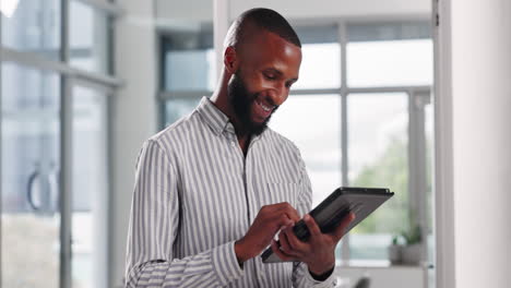 man using tablet in office