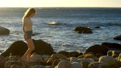 Woman-walking-in-the-beach-on-a-sunny-day-4k