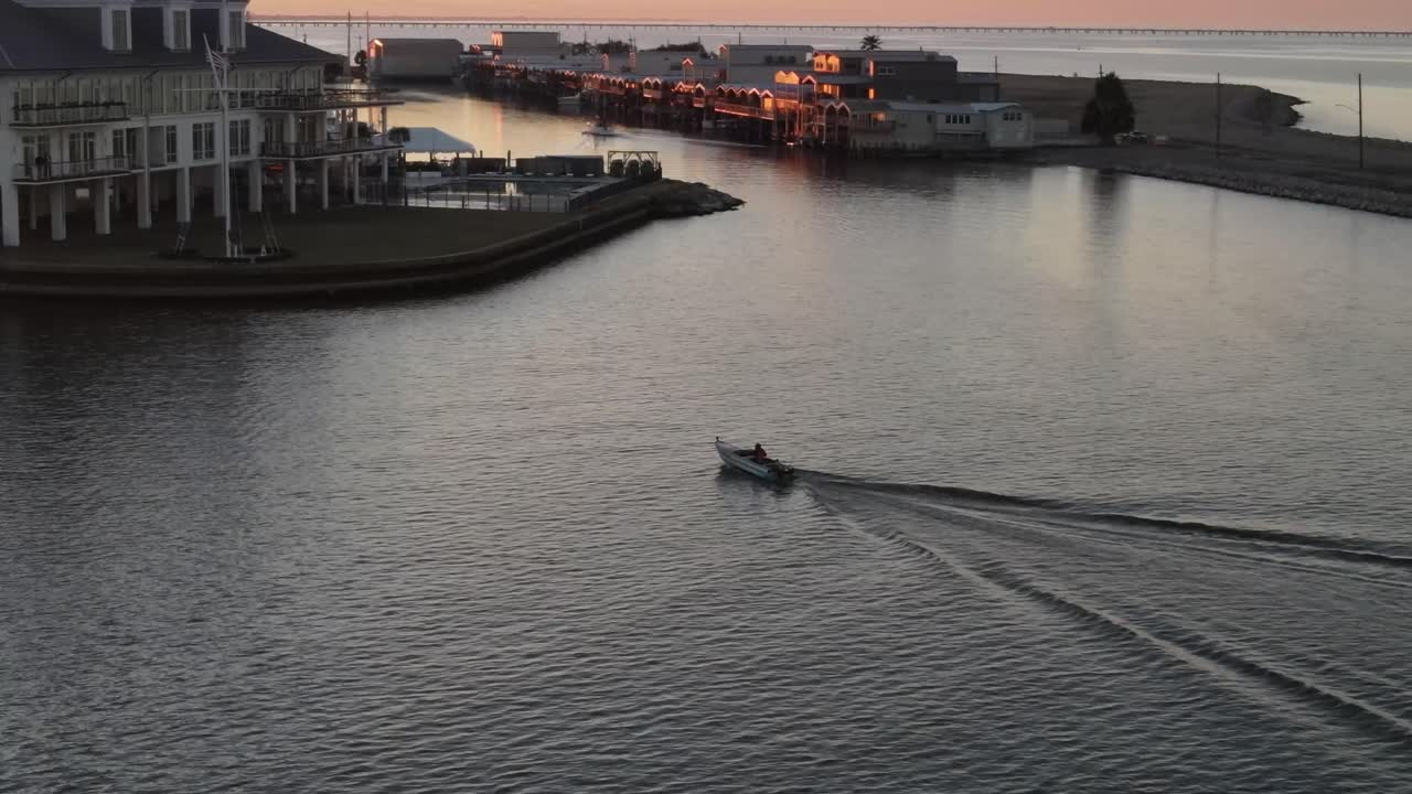 Speedboat Travels Fast Near The Building Of Southern Yacht Club In West End Point In New Orleans, USA. tracking shot