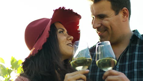 beautiful couple tasting wine in lensflares