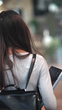 woman with backpack and laptop