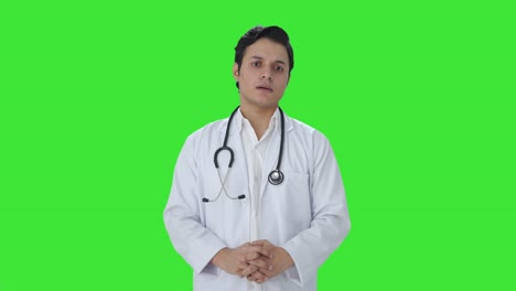 stressed indian doctor thinking something green screen