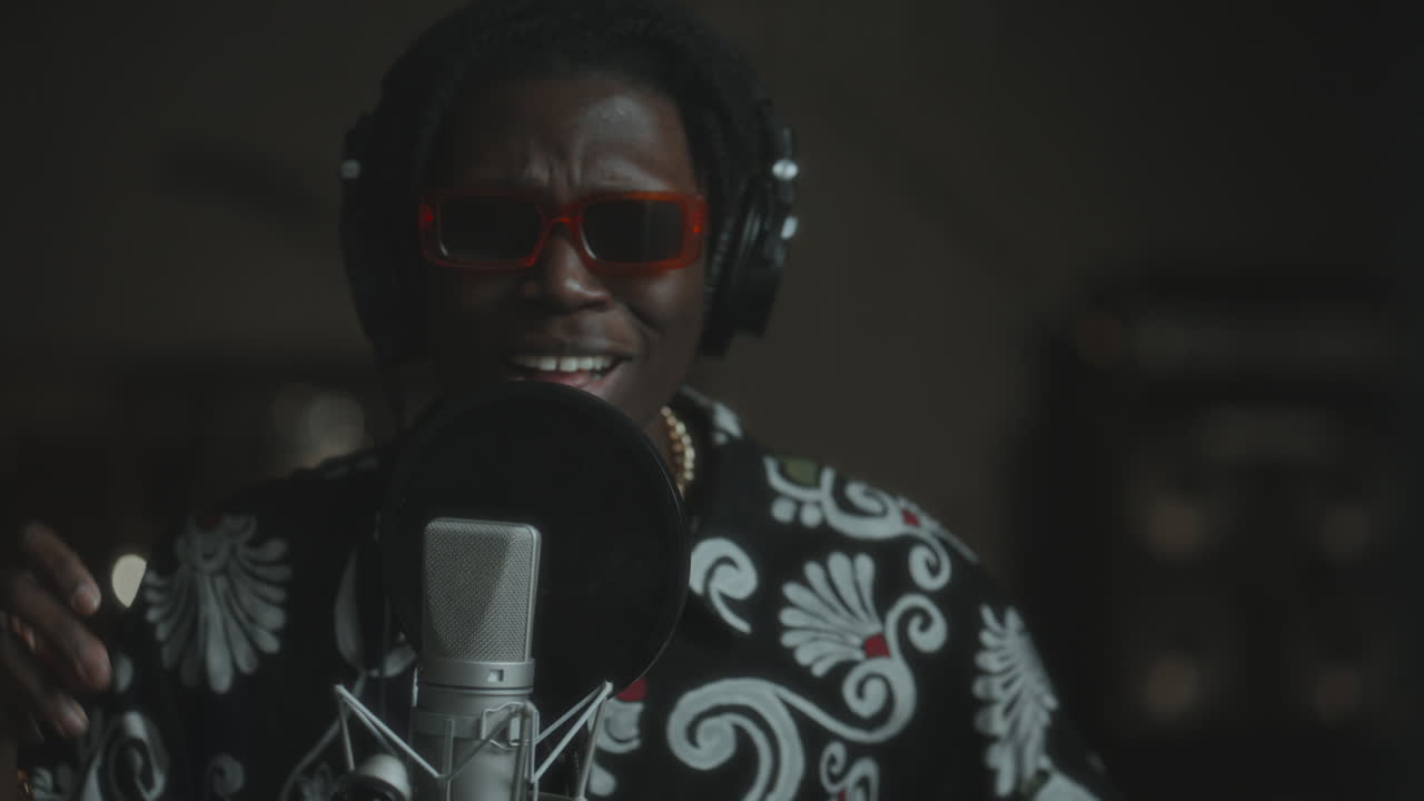 African American Singer Performing Expressively in Music Recording Studio