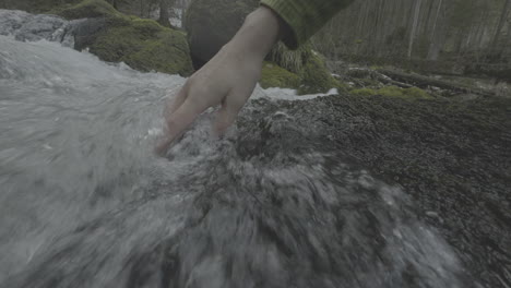 hand in a mountain stream