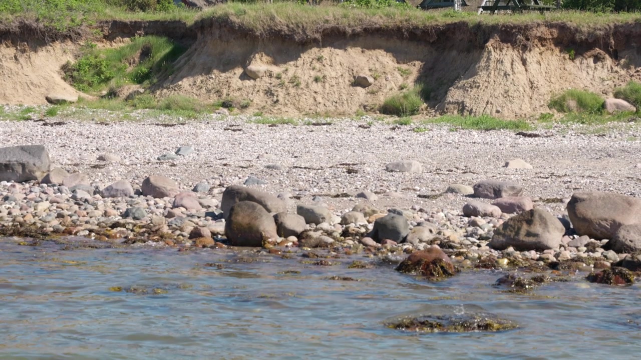 Kalundborg Saltbæk Rocky Coastline with Water and Green Vegetation