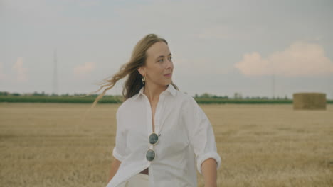 Happy-Woman-Walking-In-Field