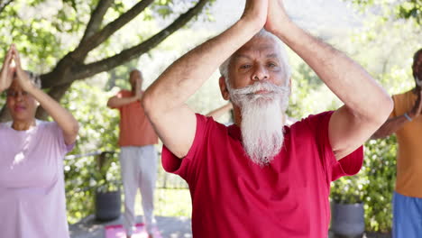 montage of happy diverse senior friends practicing yoga and enjoying christmas together, slow motion