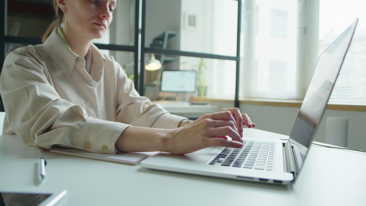 Female Office Worker Using Laptop