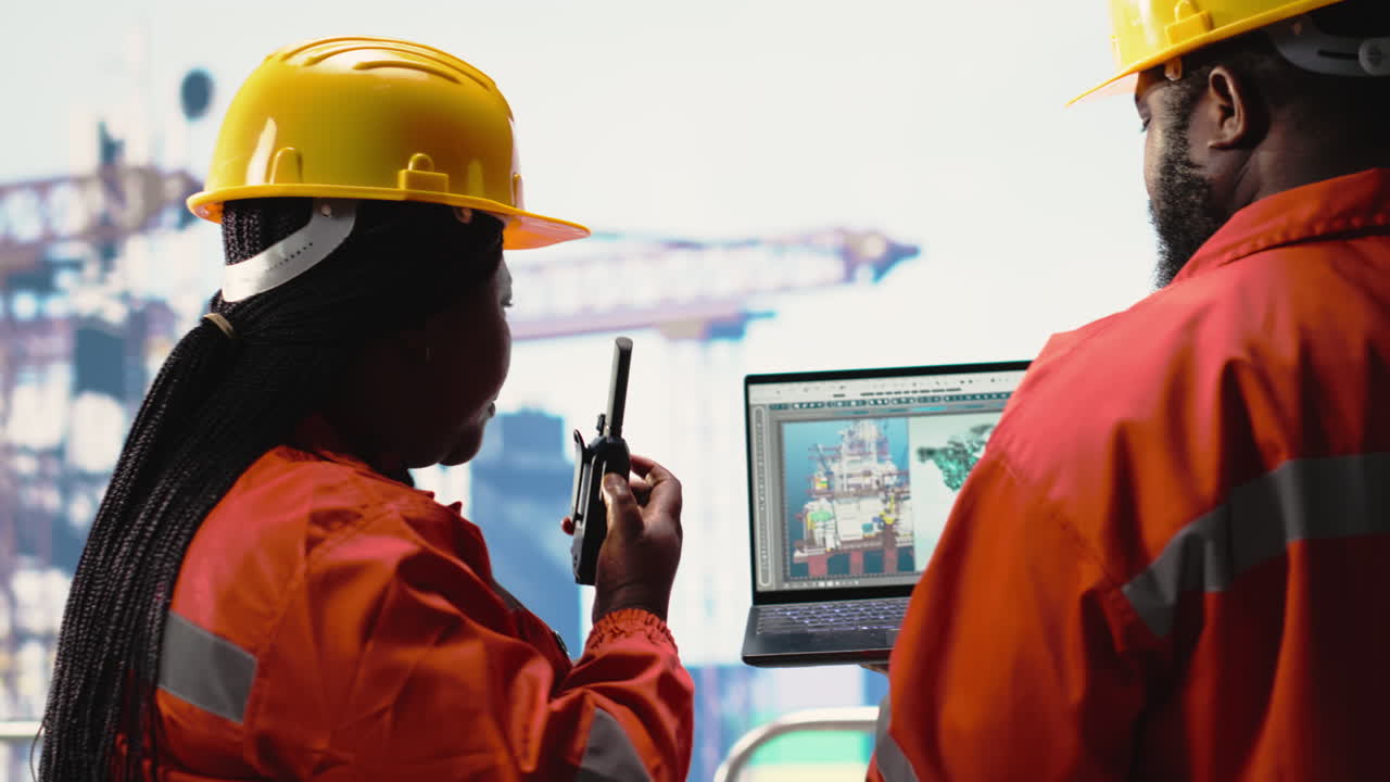 Vertical video Technicians on drilling barge deck identifying resource deposits