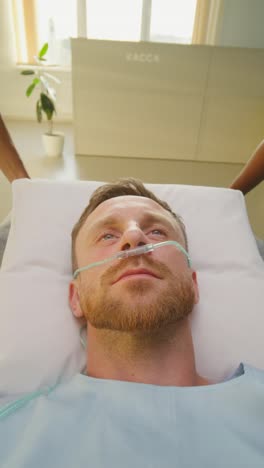 patient in hospital bed with nasal cannula